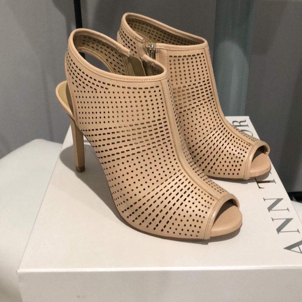 Nude pink peep toe booties with cut out detailing